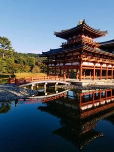 교토 뵤도인, 맑은 연못 위에 붉은 봉황당 건물과 아치형 목조 다리가 선명하게 투영된 평화로운 풍경입니다.